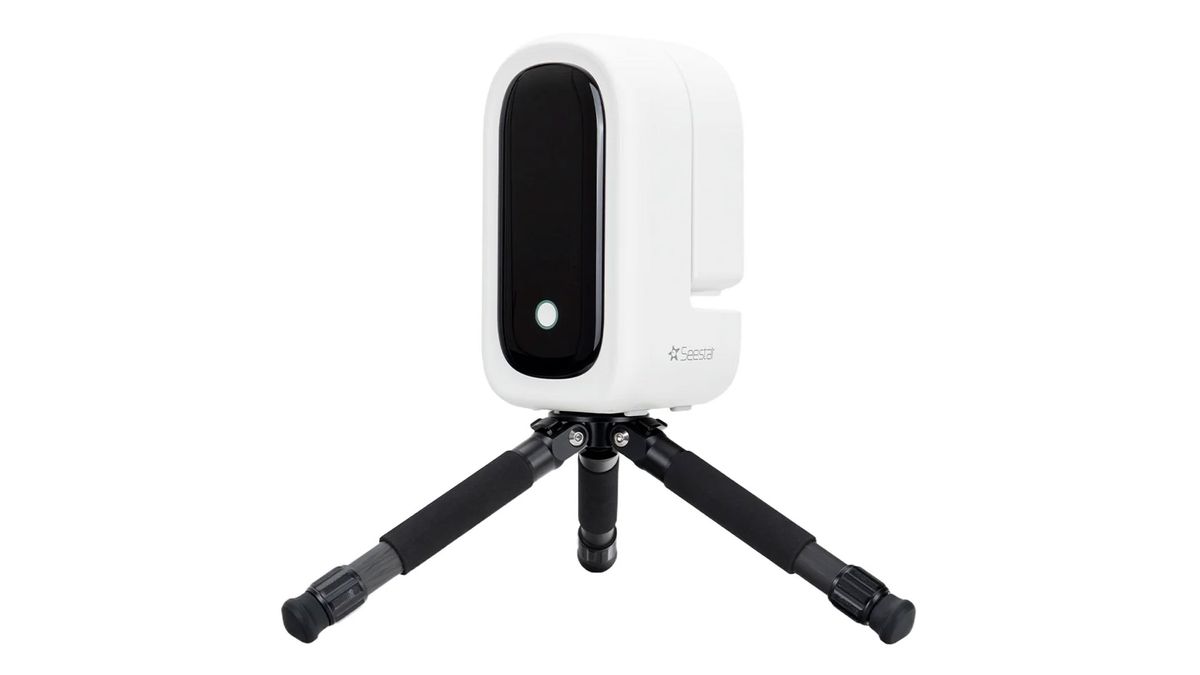 The ZWO Seestar S50 Pro smart telescope on a small black tripod, showing the power button, against a white background.