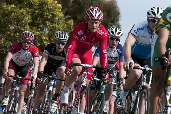 Stage one winner, Stuart Shaw (centre) of Drapac Porsche, in the peloton chasing a breakaway around thirty seconds ahead.