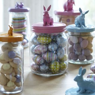 glass jar with chocolates in it