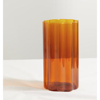 orange glass vase with a wavy edge