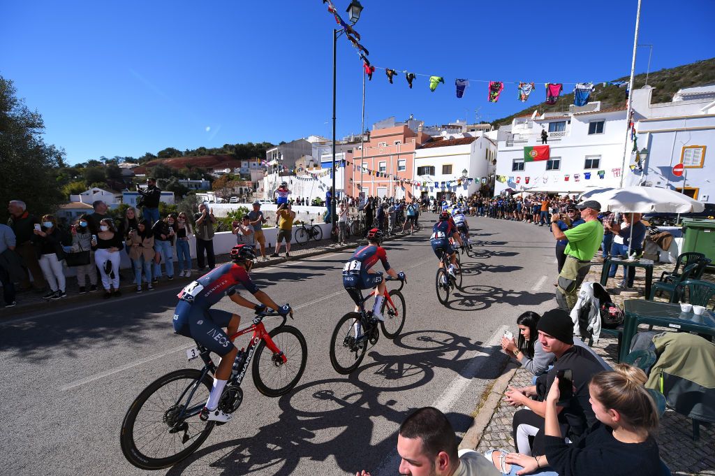 MONCHIQUE PORTUGAL FEBRUARY 17 Daniel Felipe Martinez Poveda of Colombia Ben Tulett of United Kingdom and Team INEOS Grenadiers and a general view of the peloton competing while fans cheer during the 48th Volta Ao Algarve 2022 Stage 2 a 1824km stage from Albufeira to Alto Da Foia Monchique 890m VAlgarve2022 on February 17 2022 in Monchique Portugal Photo by Luc ClaessenGetty Images