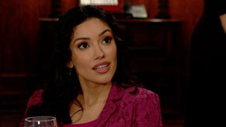 Zuleyka Silver as Audra sitting down in a maroon shirt in The Young and the Restless