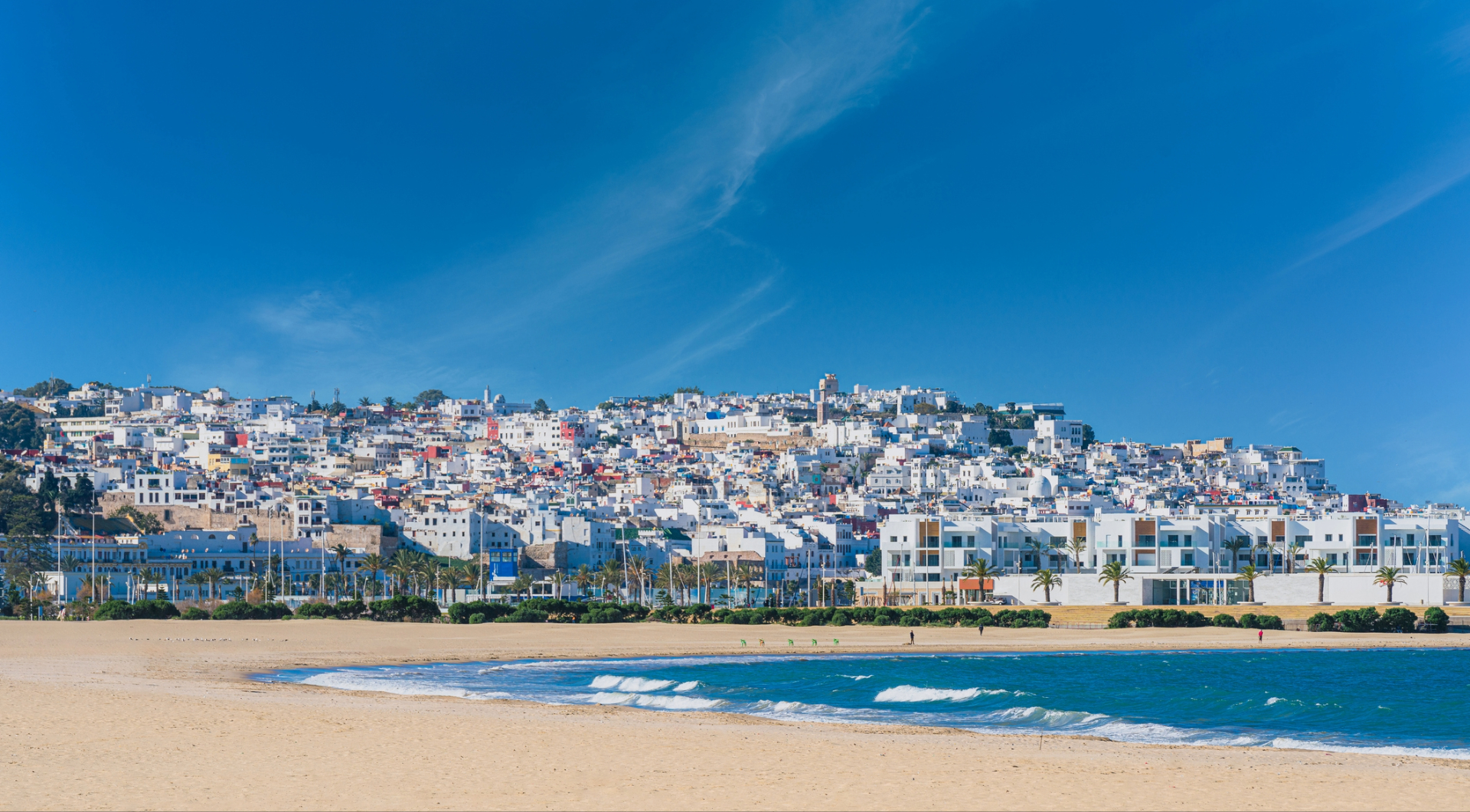 A Tangier beach is full of urban development right next to the ocean