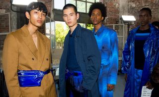 Models wear brown jacket and blue suits at Dries Van Noten S/S 2019