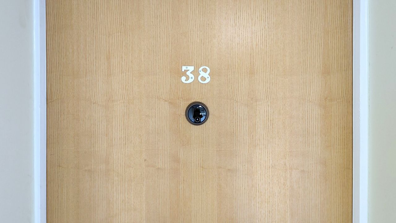 Ezviz Wire-Free Peephole Door Viewer EP4 camera on outside of door