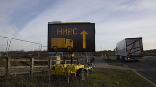 A sign for HMRC (Her Majestys Revenue and Customs) outside the Waterbrook Inland Border facility near Ashford