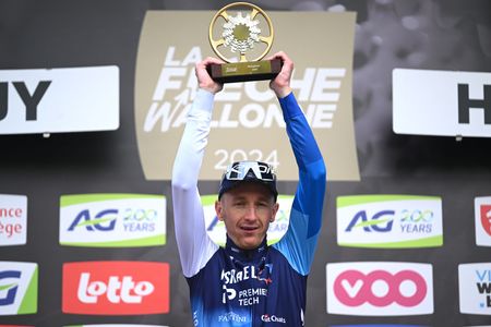 Stevie Williams celebrates at podium as race winner during the 88th La Fleche Wallonne 2024