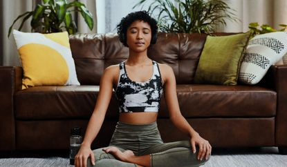 Woman meditating with headphones