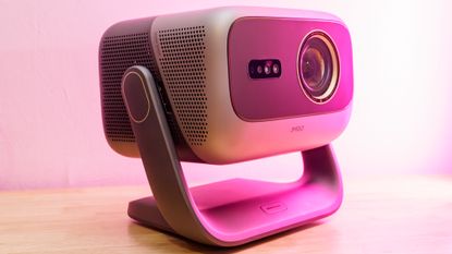 A JMGO N3 Ultimate projector on a desk