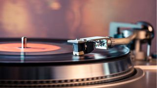 A record player with a vinyl playing on it