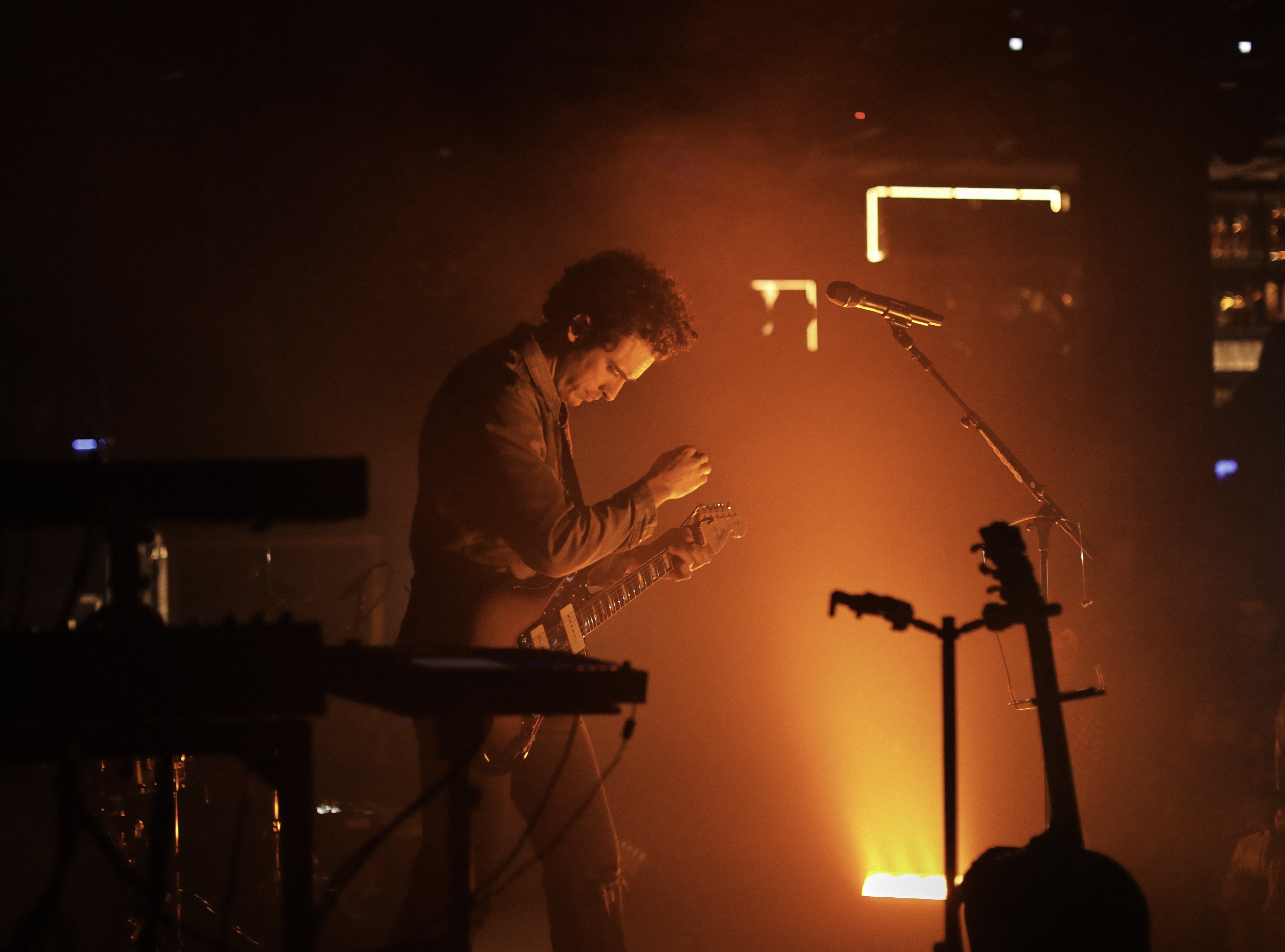 Marc Scibilia performing on a dimly lit stage