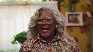 Tyler Perry speaking forcefully in the kitchen as Madea in Tyler Perry's A Madea Homecoming.