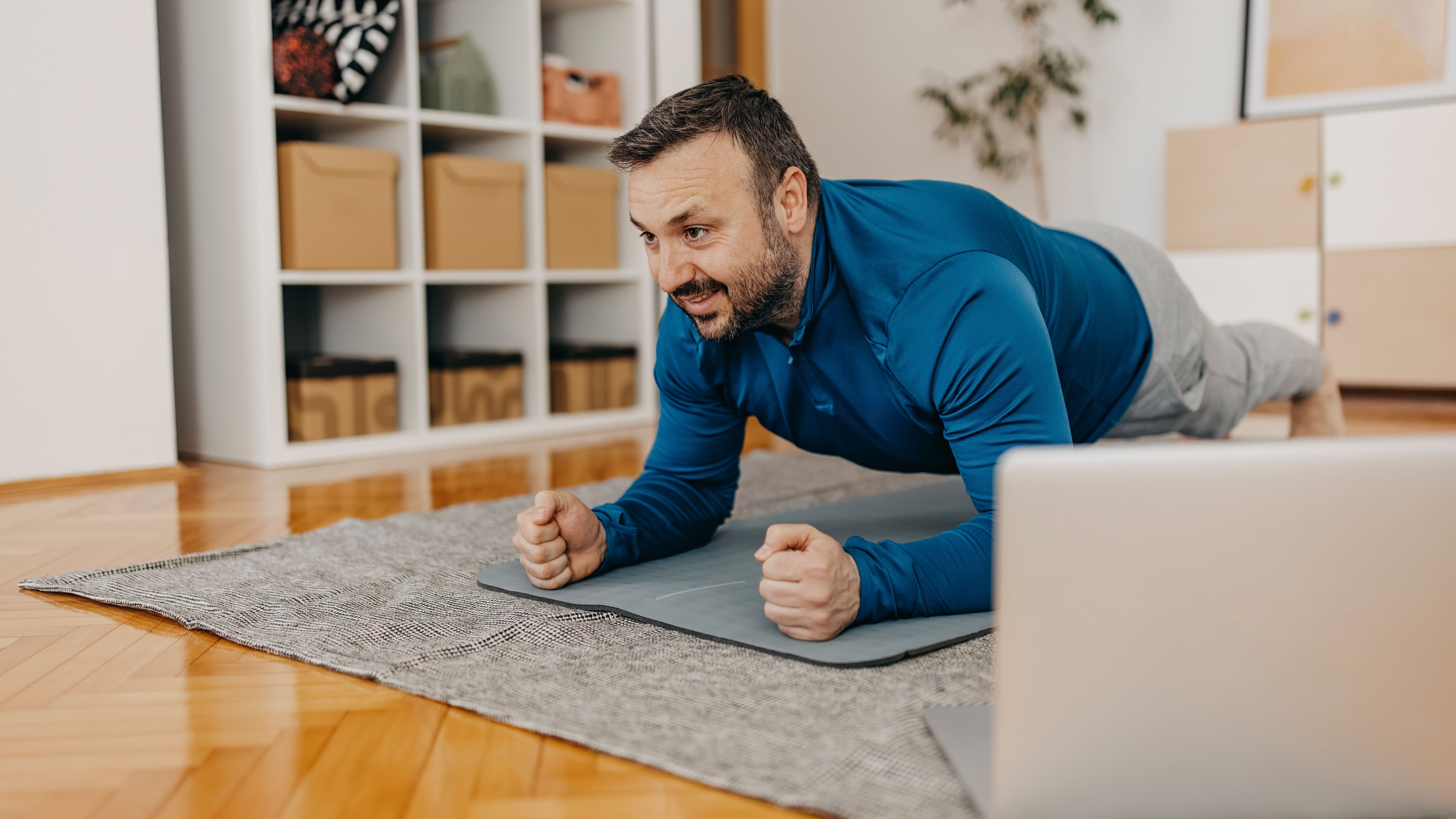 Man doing plank exercise at home