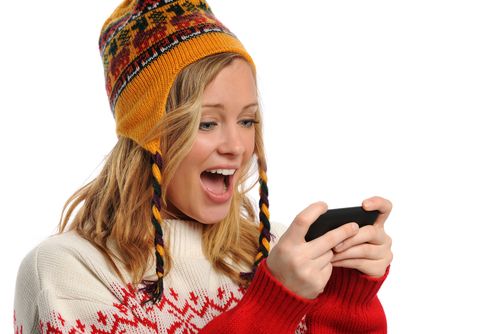 Girl texting in the cold