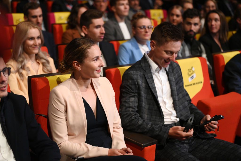 20Tadej Pogacar sat next to Juliette Labous at the 23 Tour de France presentation