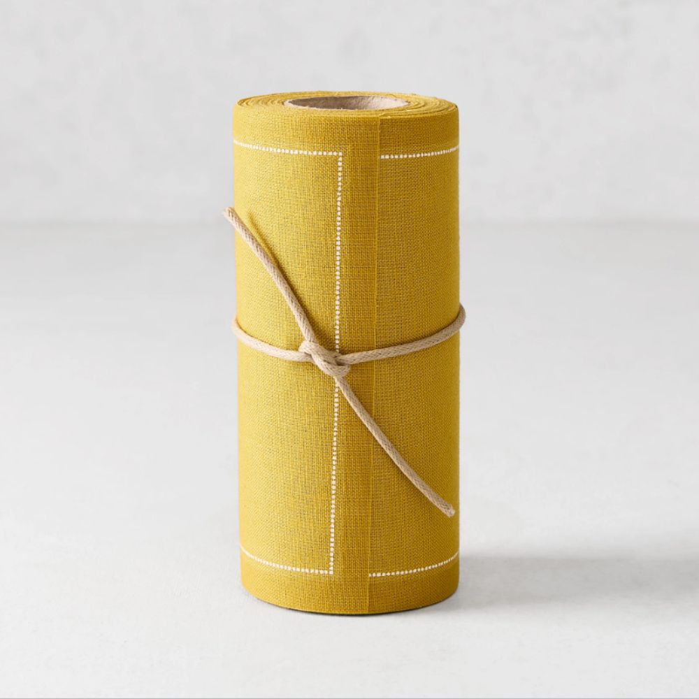 Tear-off roll of yellow cotton napkins