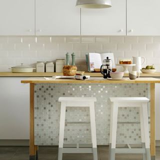 kitchen with white colour and two stool