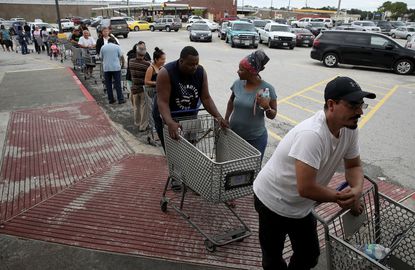 People line up for groceries after Hurricane Harvey subsides.