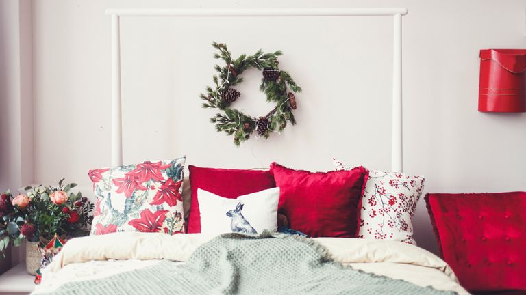 a christmas bedroom with christmas bedding