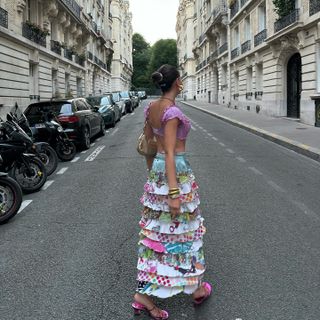 Influencer wears a ruffle skirt.