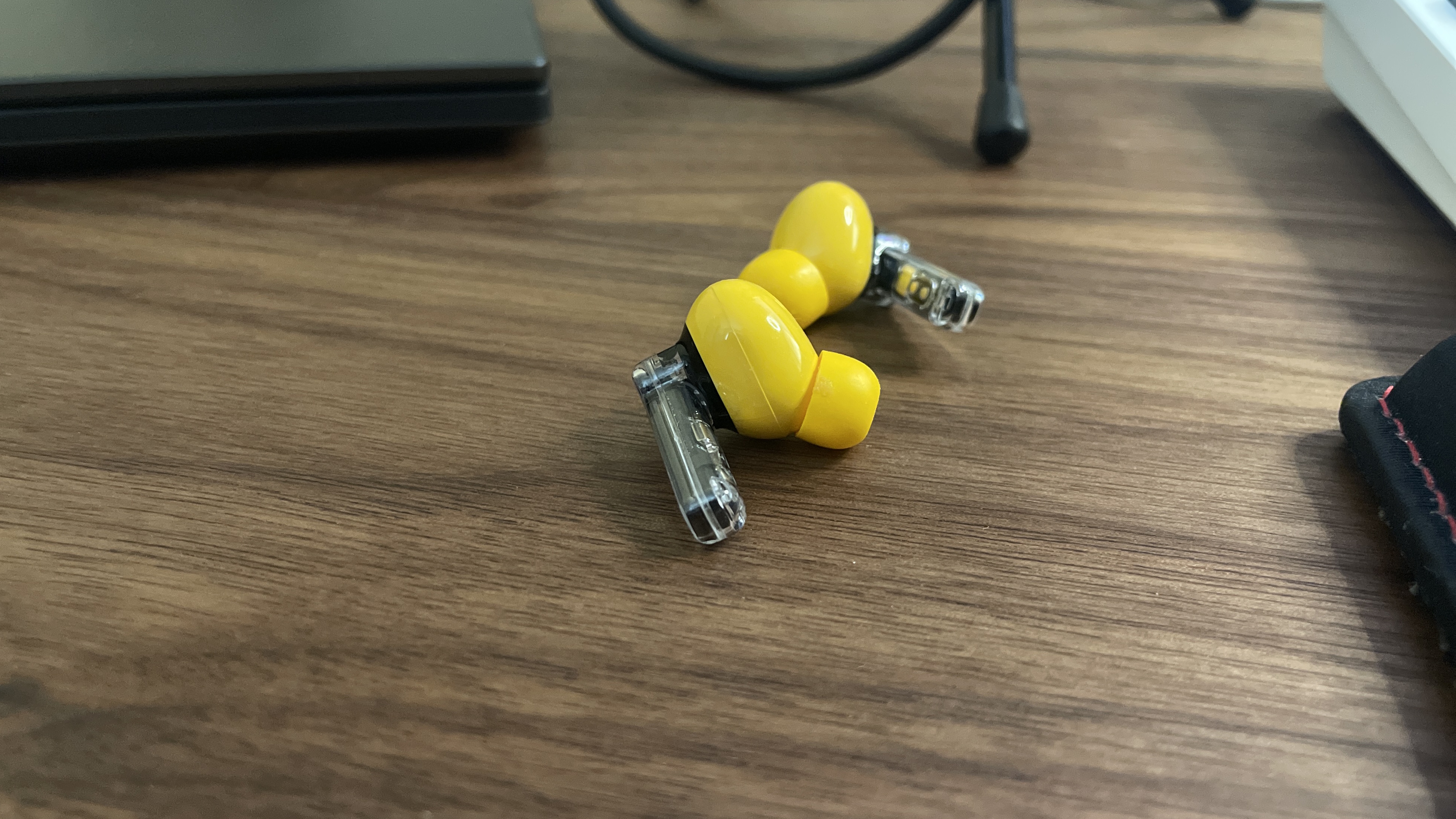 Nothing Ear (a) earbuds on a desk