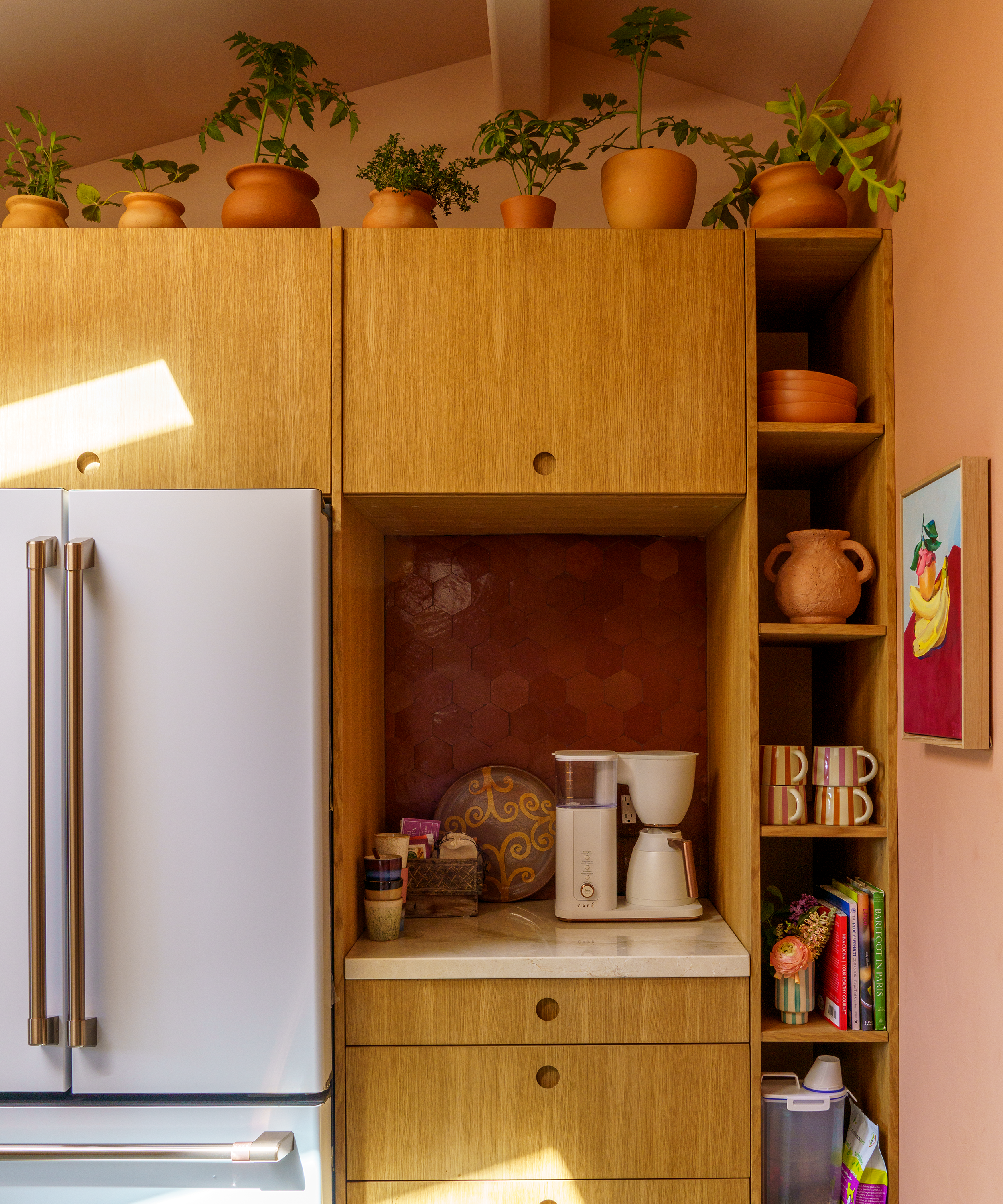 wood kitchen decorated with terracotta vessels
