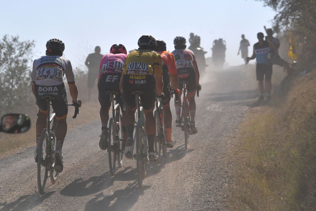 SIENA ITALY AUGUST 01 Maximilian Schachmann of Germany and Team BoraHansgrohe Wout van Aert of Belgium and Team JumboVisma Gravel Strokes during the Eroica 14th Strade Bianche 2020 Men a 184km race from Siena to SienaPiazza del Campo StradeBianche on August 01 2020 in Siena Italy Photo by Tim de WaeleGetty Images