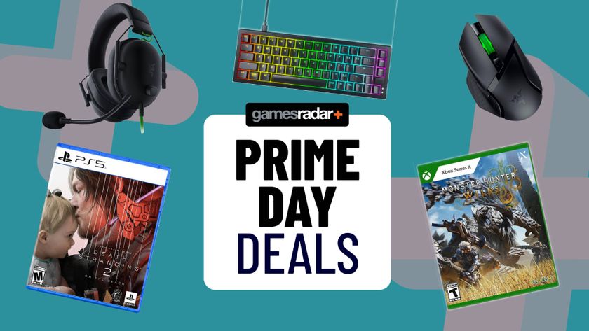 Several games boxes and peripherals next to a sign marking &#039;Prime Day Deals&#039;.