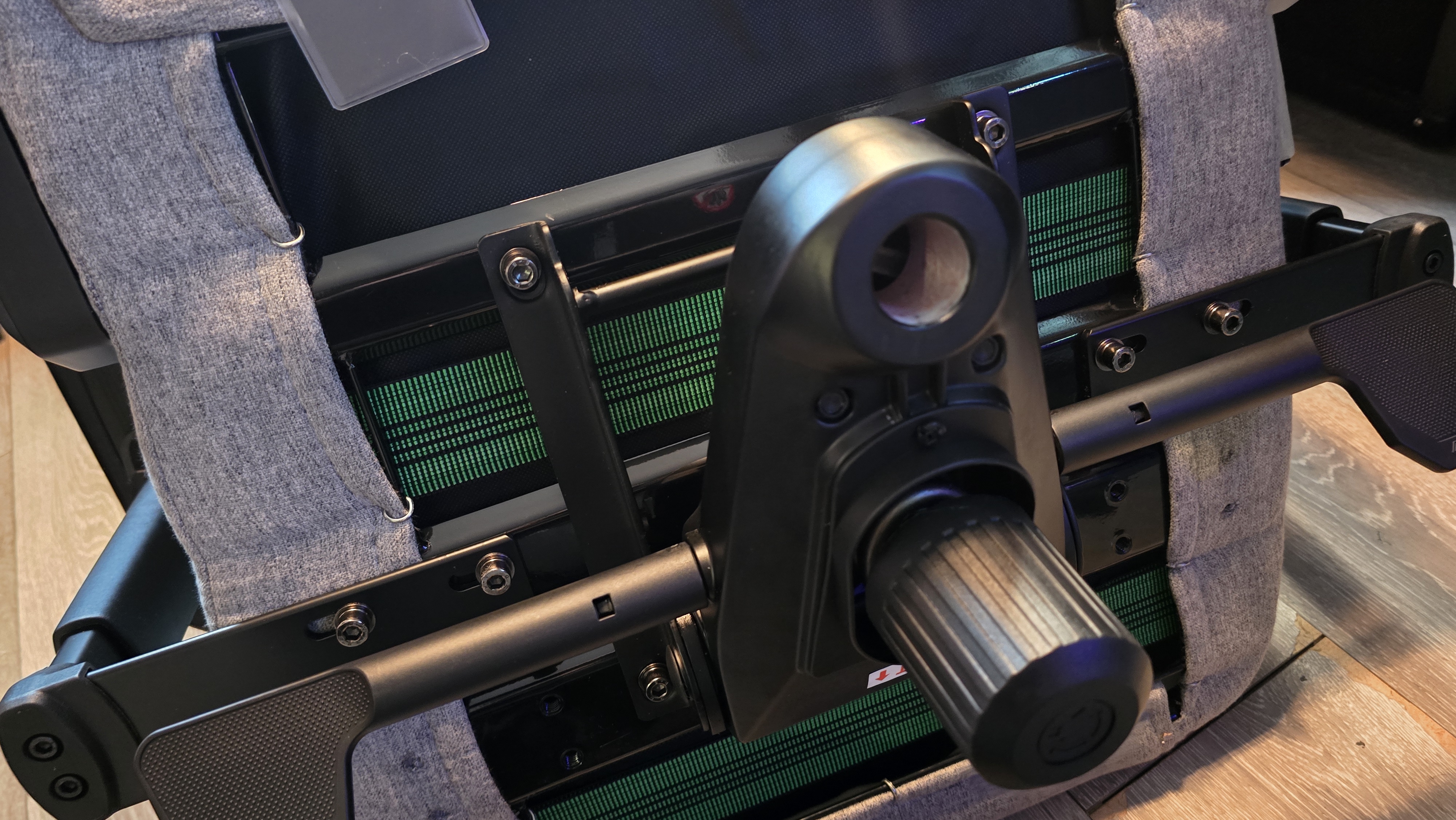 The back of a gaming chair, showing the assembly components for the back support and base