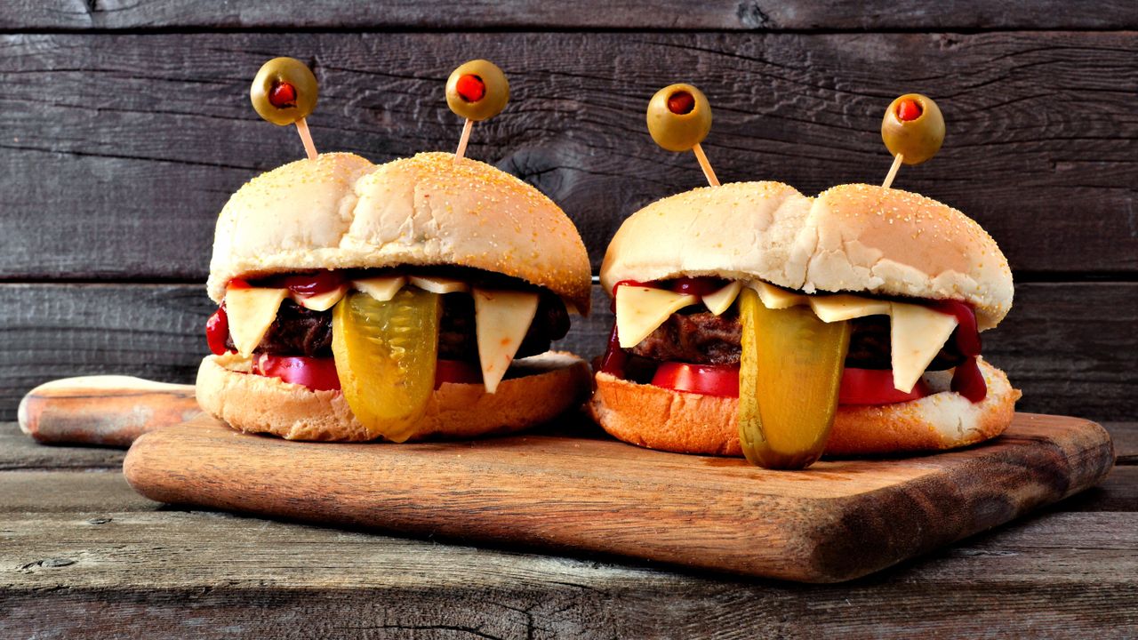 Annabel Karmel&#039;s veggie burgers styled up with faces and sticking our tongues