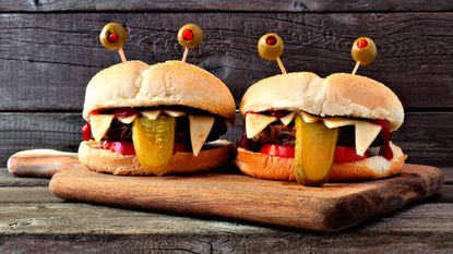 Annabel Karmel's veggie burgers styled up with faces and sticking our tongues