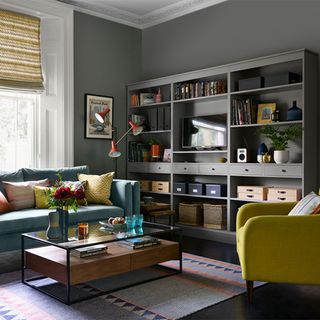 grey living room with grey painted shelf unit