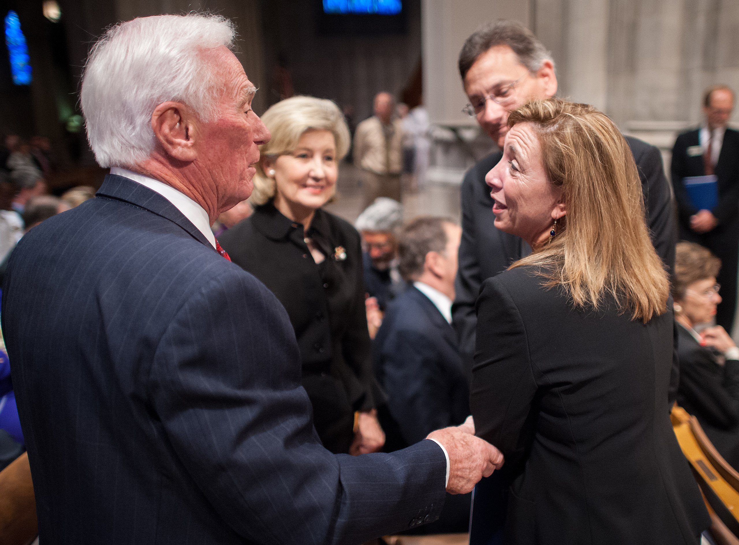 Apollo 17 mission commander Gene Cernan, left, the last man to walk on the moon, speaks with NASA Deputy Administrator Lori Garver, right, as U.S. Senator Kay Bailey Hutchison, R-Texas, centre, looks on prior to a memorial service celebrating the life of Neil Armstrong, on Thursday, 13 September 2012, at the Washington National Cathedral.