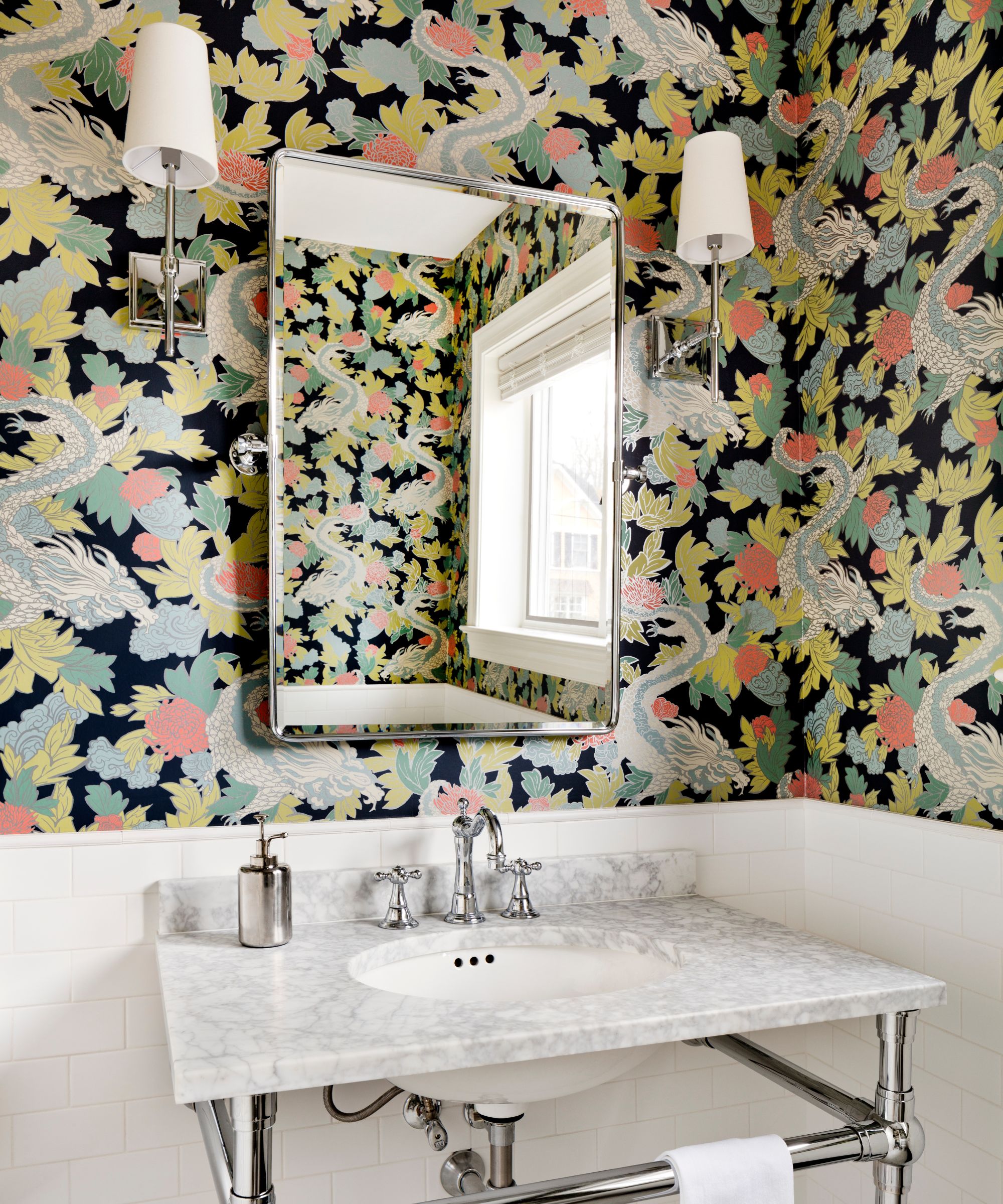 A powder room with the lower half of the walls covered in white tiles and the upper half decorated with an animal-themed wallpaper