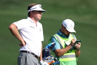 Keith Mitchell chats to his caddie