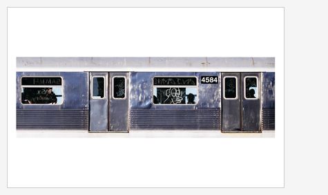 An old silver train carriage with the number 4584