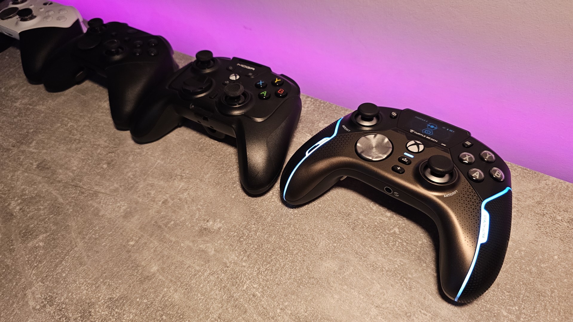 Game controllers lined up on a desk