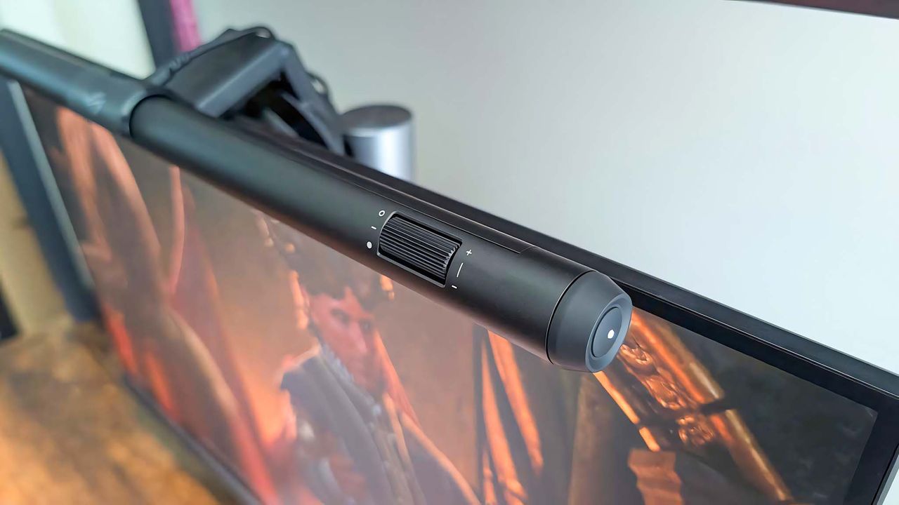 A shot of the ASUS ROG Aura Monitor Light Bar that focuses on the brightness dial and side button.