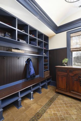 clubroom style mudroom with lockers and antique chest of drawers