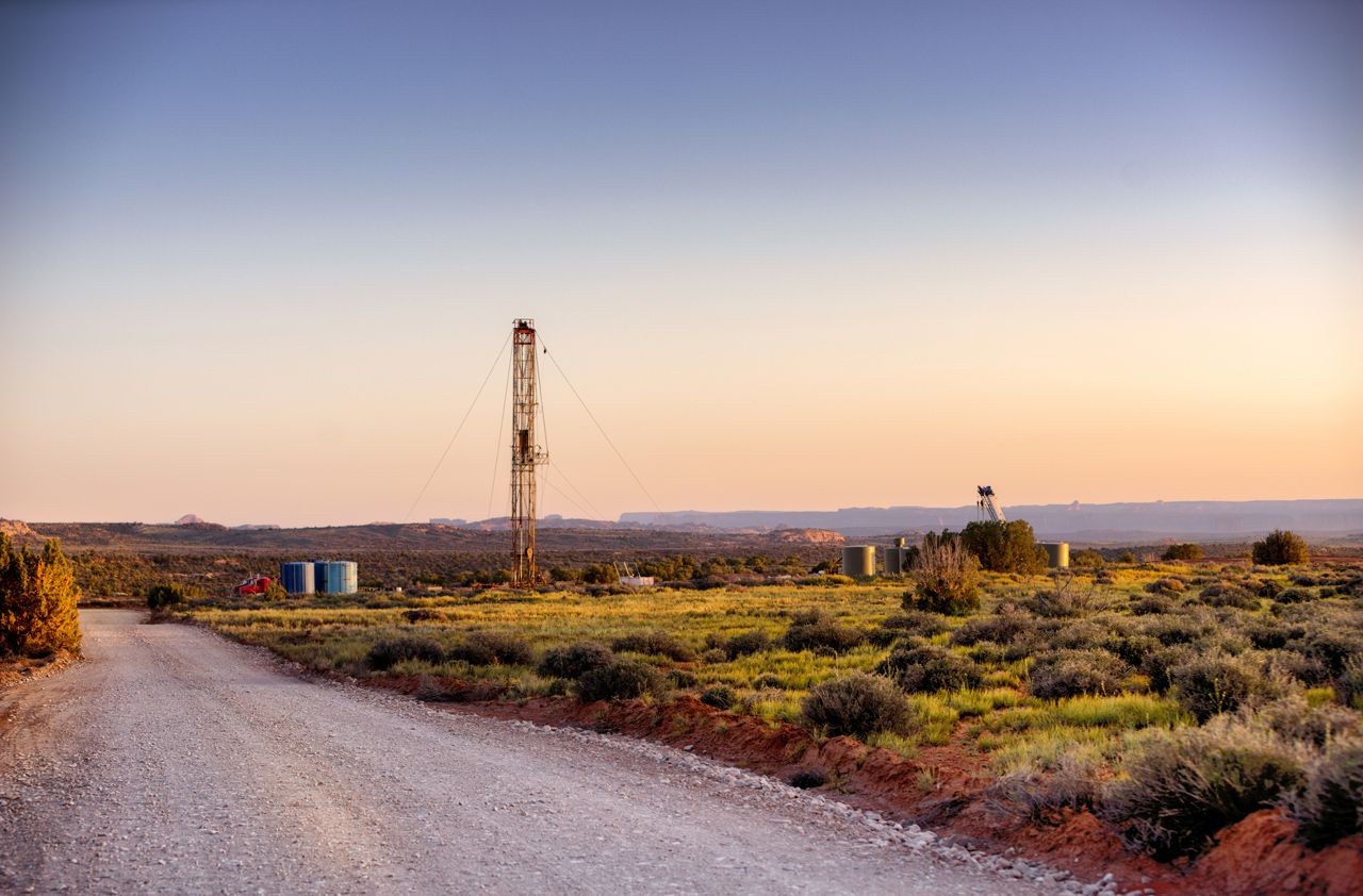 Drilling Fracking Rig in the Southwest desert at sunset