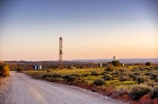 Drilling Fracking Rig in the Southwest desert at sunset
