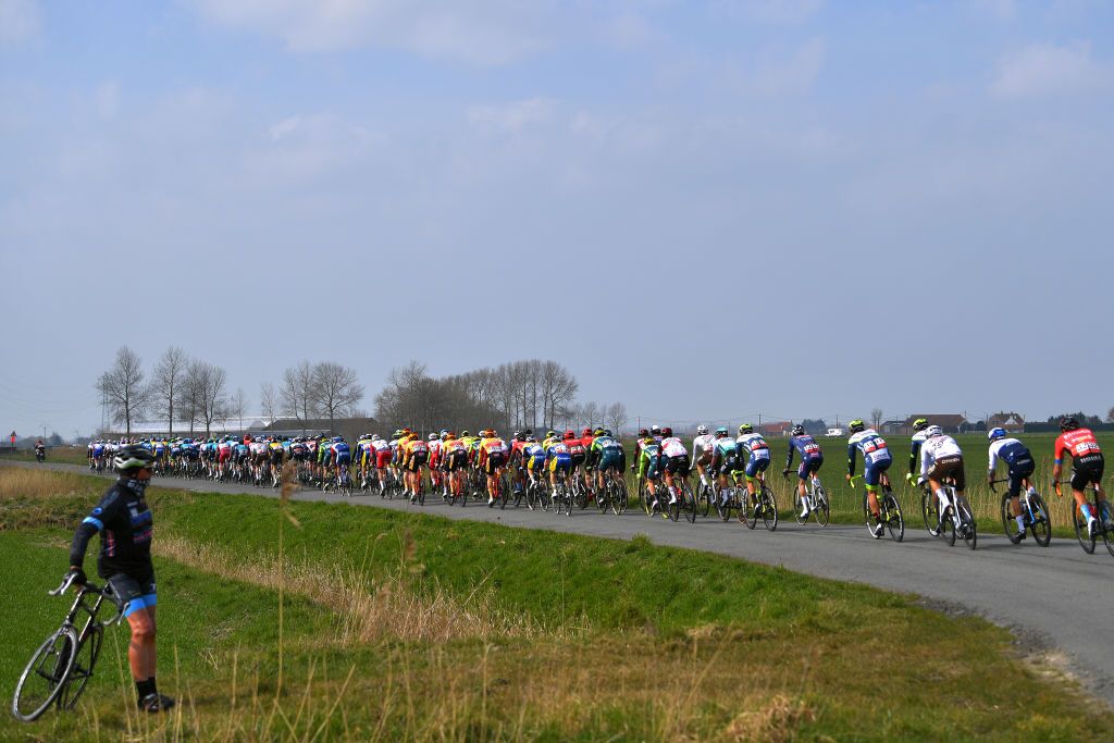 DE PANNE BELGIUM MARCH 24 The Peloton during the 45th Oxyclean Brugge De Panne 2021 Men Classic a 2039km race from Brugge to De Panne Fans Public OxycleanClassic on March 24 2021 in De Panne Belgium Photo by Luc ClaessenGetty Images
