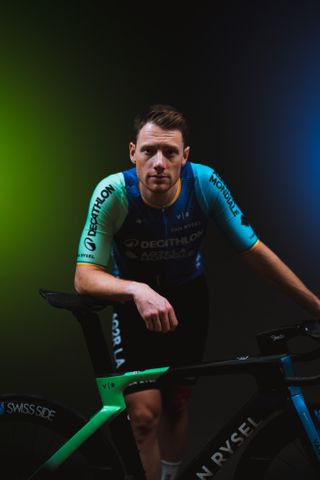 Sam Bennett in his new Decathlon AG2R La Mondiale kit, which has a blue torso, with one light blue arm, and one teal arm