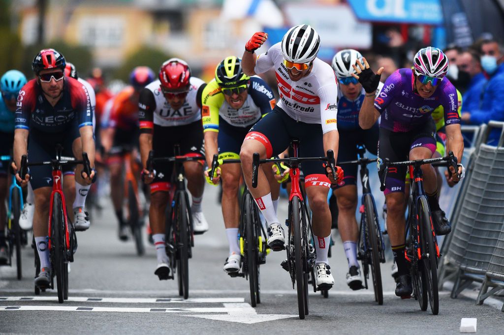 TORREVIEJA SPAIN FEBRUARY 05 Matteo Moschetti of Italy and Team Trek Segafredo celebrates winning ahead of Manuel Penalver Aniorte of Spain and Team Burgos BH and Alexander Kristoff of Norway and Team Intermarch Wanty Gobert Matriaux during the 73rd Volta A La Comunitat Valenciana 2022 Stage 4 a 1931km stage from Orihuela to Torrevieja VCV2022 on February 05 2022 in Torrevieja Spain Photo by Dario BelingheriGetty Images