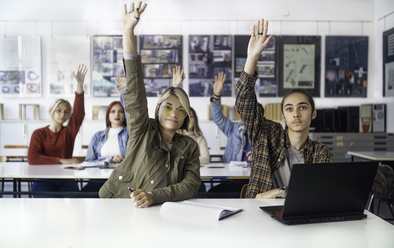 Students raising their hands