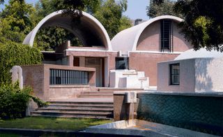 vaulted office with small recessed windows and doors