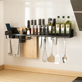 kitchen with wall-hung utensil and chopping board storage