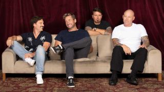 Nickelback sitting on a sofa