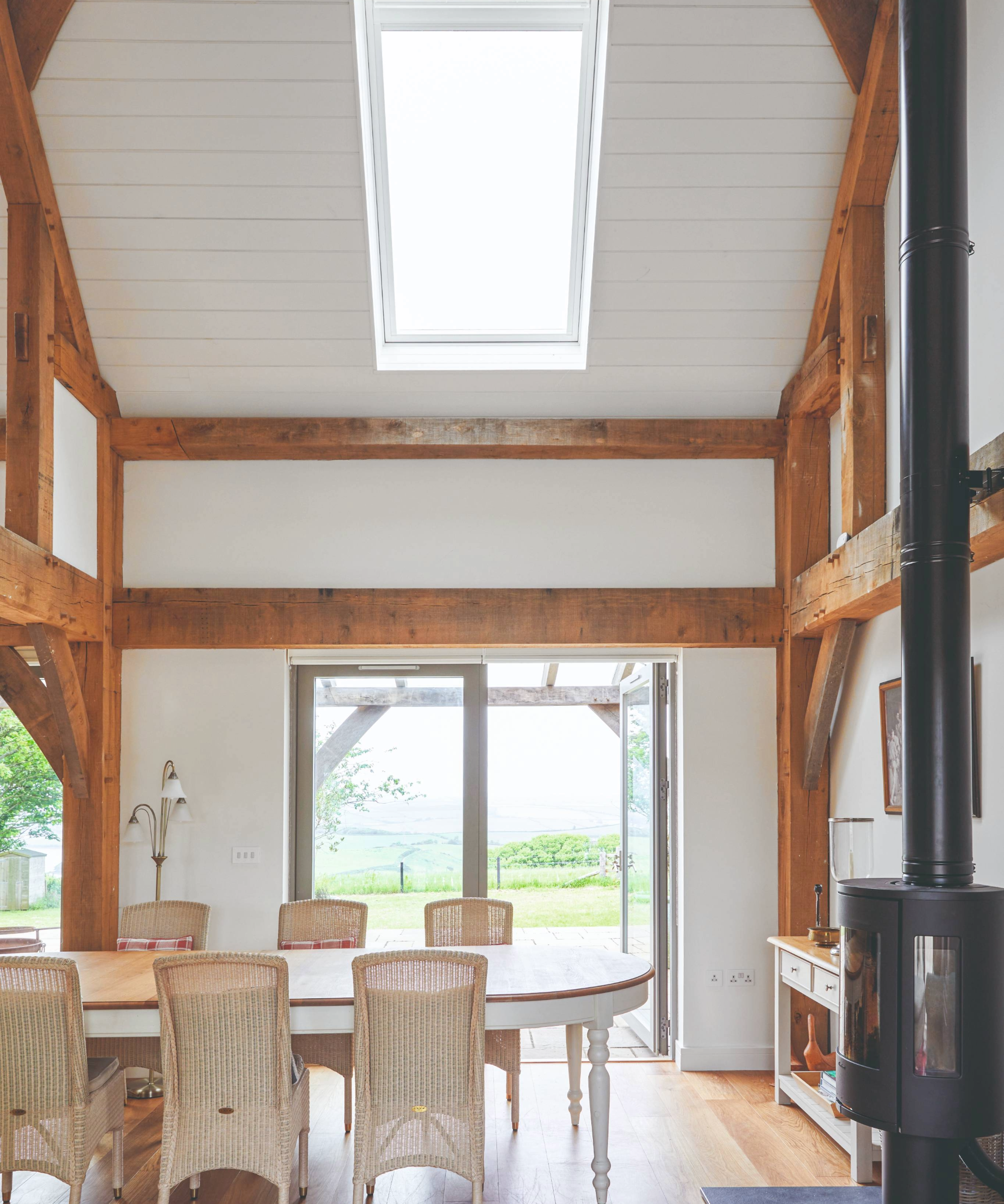 Dining room area with doors opening onto countryside views