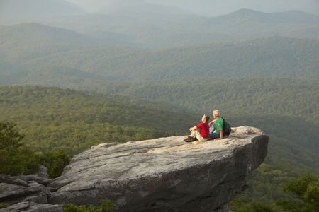 A695CR mature couple sitting on rock in Blue Ridge Mountains North Carolina